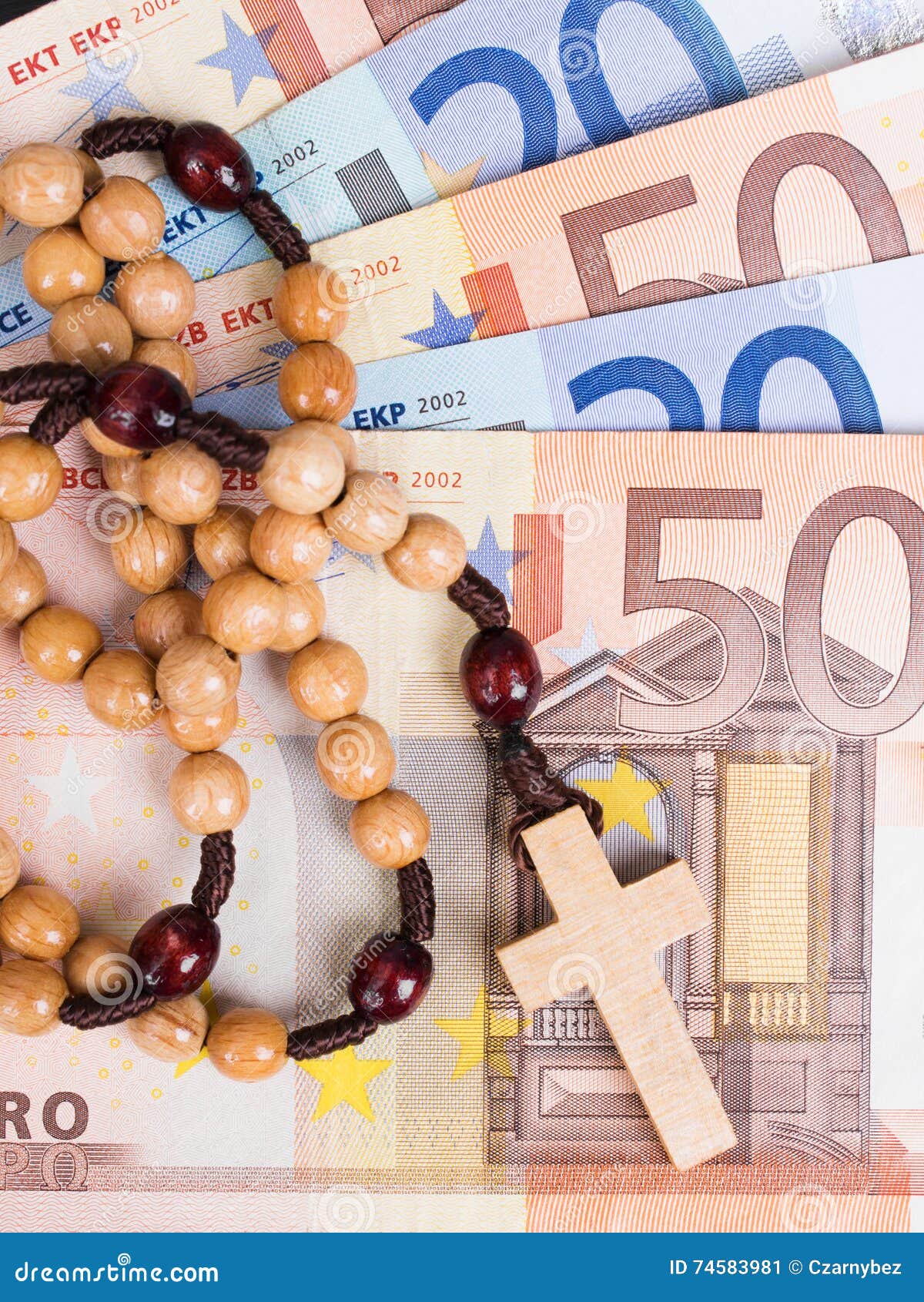 closeup-wooden-rosary-eurp-banknotes-euro-74583981.jpg